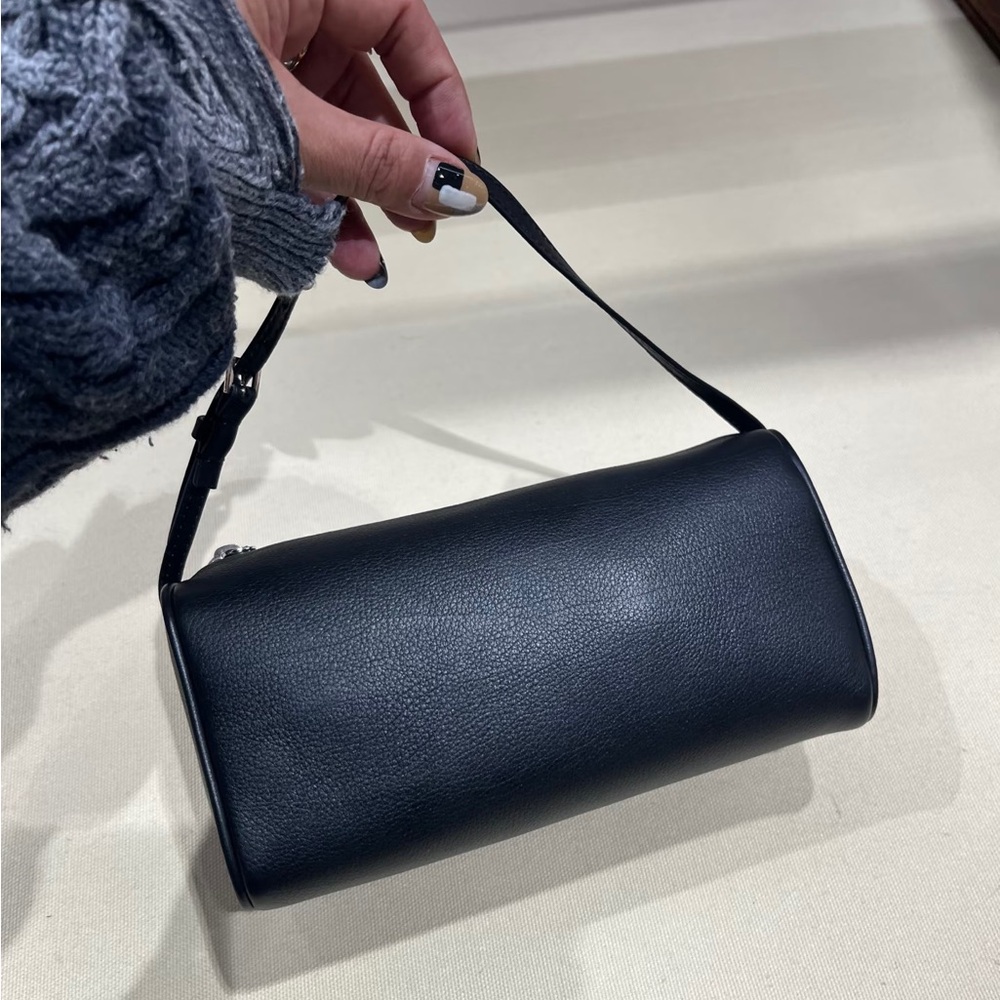 Elegant Black Leather Wristlet by [Brand]